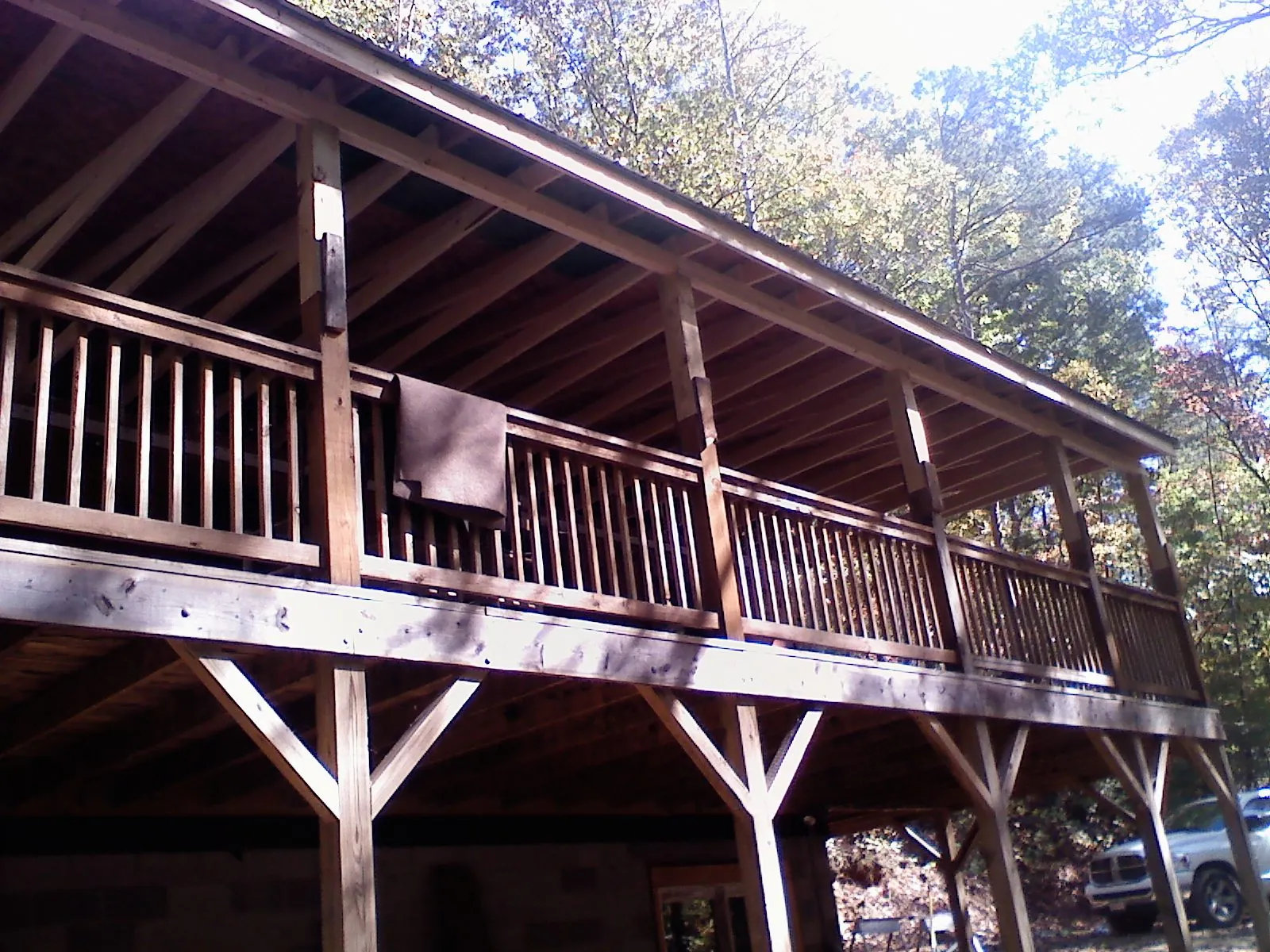 Timber framing under a new elevated porch and deck — Roof Leak Repair in Bretton Woods by Roofing Brothers